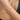 Woman wearing a link chain bracelet with cubic zirconia stones on her wrist