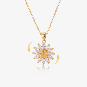 collar dorado con dije de girasol giratorio de circonitas cúbicas, con flechas de rotación