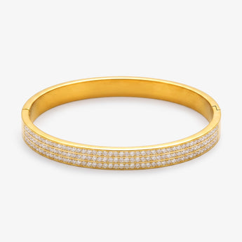 Gold-tone stainless steel bangle bracelet with three rows of clear stones on white background