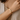 Model wearing a gold-tone smooth C-shaped open bracelet engraved with Love You
