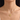 Woman wearing the gold-tone engraved birth flower disc necklace