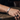 Man wearing a silver-tone custom engraved chain bracelet on his wrist
