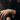 Close-up of a man's hand and wrist wearing a silver-tone engraved chain bracelet