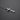 Silver-tone cross pendant necklace with engraved text on the side lying on a dark surface